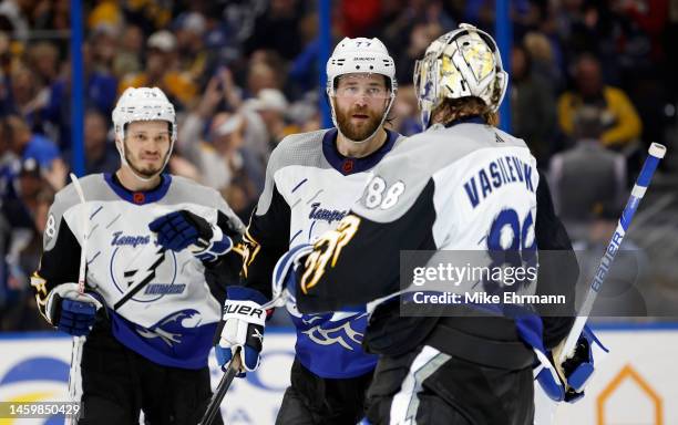 Victor Hedman and Andrei Vasilevskiy of the Tampa Bay Lightning celebrates winning a game against the Boston Bruins at Amalie Arena on January 26,...