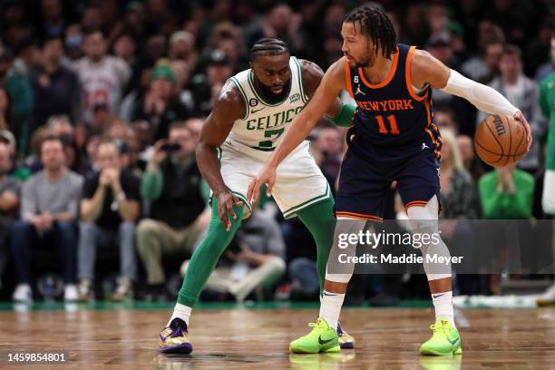 Jaylen Brown of the Boston Celtics defends Jalen Brunson of the New York Knicks during the second half at TD Garden on January 26, 2023 in Boston,...