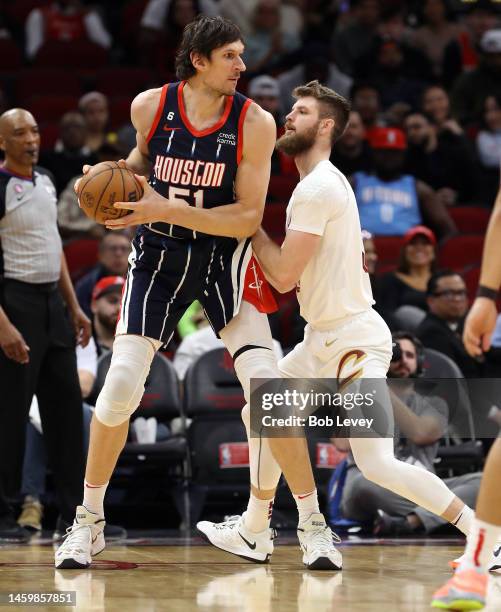 Boban Marjanovic of the Houston Rockets posts up Dean Wade of the Cleveland Cavaliers during the fourth quarter of the game at Toyota Center on...