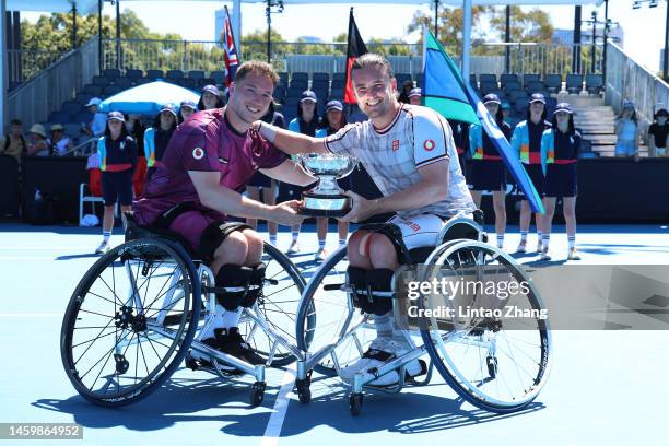 Alfie Hewett and Gordon Reid of Great Britain pose with a trophy after winning in the Men's Wheelchair Doubles Final against Maikel Scheffers and...