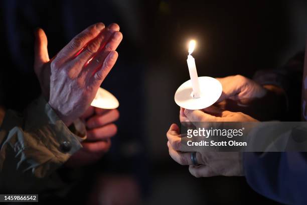 People light candles as they attend a candlelight vigil in memory of Tyre Nichols at the Tobey Skate Park on January 26, 2023 in Memphis, Tennessee....