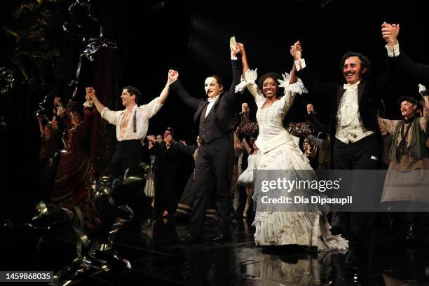 John Riddle as "Raoul", Ben Crawford as "The Phantom", Emilie Kouatchou as "Christine", and cast take their curtain call at the 35th anniversary...