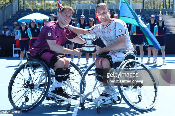 Alfie Hewett and Gordon Reid of Great Britain pose with a trophy after winning in the Men's Wheelchair Doubles Final against Maikel Scheffers and...