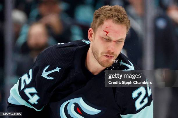 Jamie Oleksiak of the Seattle Kraken reacts after fighting Luke Schenn of the Vancouver Canucks during the second period at Climate Pledge Arena on...