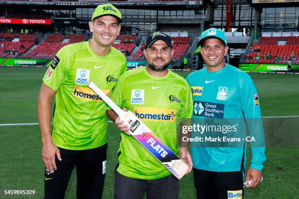 Hazem El Masri, former professional rugby league footballer poses with captains Usman Khawaja of the Heat and Chris Green of the Thunder after the...