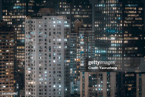 the exterior of apartment buildings at night - apartment exterior ストックフォトと画像
