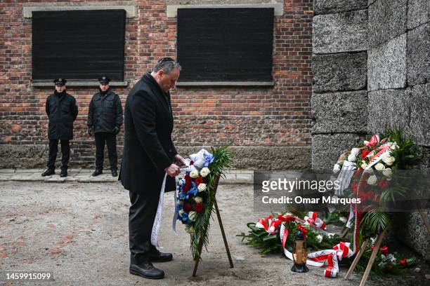 Second Gentleman, Douglas Emhoff, lays wreaths honoring victims of the Nazi regime by the death wall during the Holocaust Remembrance Day at the...