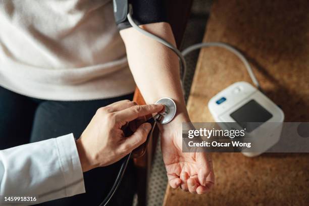 close-up of doctor examining patient - homes new york screening stock pictures, royalty-free photos & images