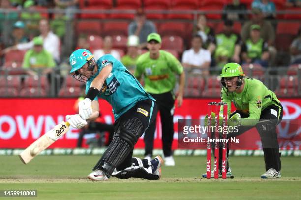Marnus Labuschagne of the Heat plays a slog sweep during the Men's Big Bash League match between the Sydney Thunder and the Brisbane Heat at Sydney...