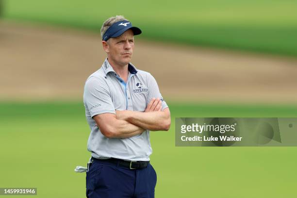 Luke Donald of England looks on after their second shot on the 10th hole during Day Two of the Hero Dubai Desert Classic at Emirates Golf Club on...