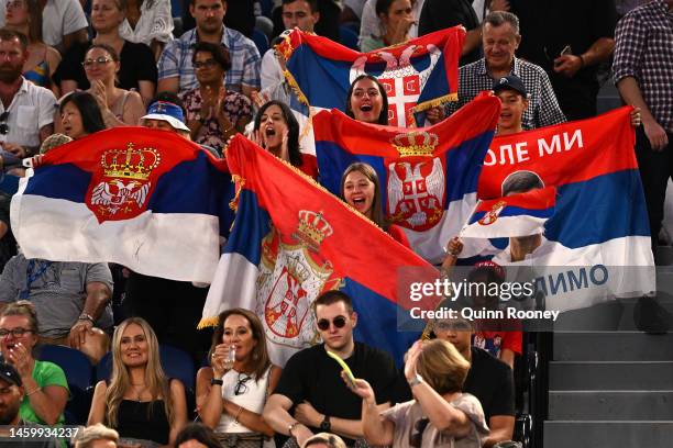 Spectators hold Serbian flags during the Semifinal singles match between Novak Djokovic of Serbia and Tommy Paul of the United States during day 12...