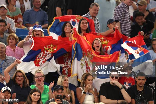 Spectators hold Serbian flags during the Semifinal singles match between Novak Djokovic of Serbia and Tommy Paul of the United States during day 12...