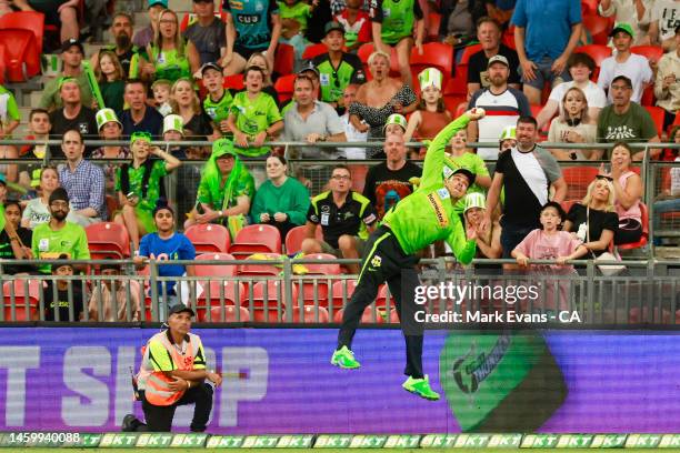 Chris Green of the Thunder saves a four during the Men's Big Bash League match between the Sydney Thunder and the Brisbane Heat at Sydney Showground...