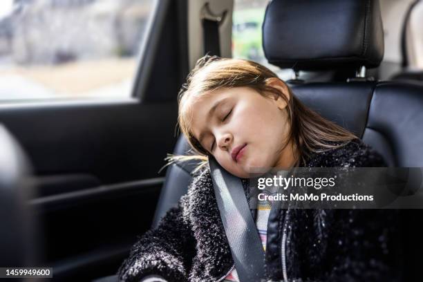 young girl sleeping in passenger car - sleeping in car stock pictures, royalty-free photos & images