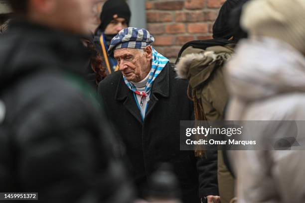 Survivors of the Auschwitz concentration camp and families arrive to lay wreaths honoring victims of the Nazi regime by the death wall during the...