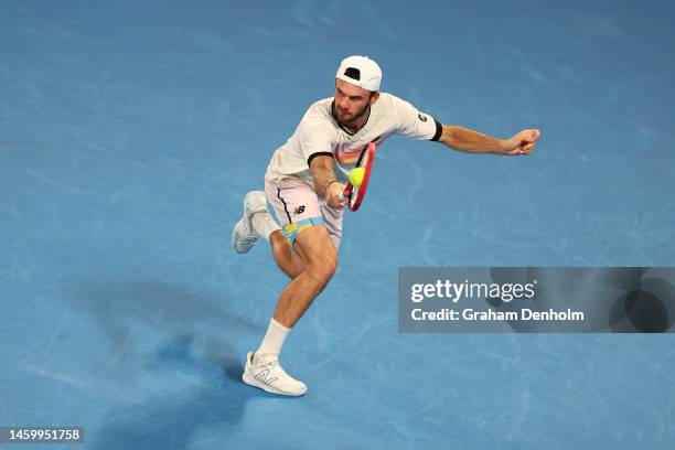 Tommy Paul of the United States plays a backhand in the Semifinal singles match against Novak Djokovic of Serbia during day 12 of the 2023 Australian...