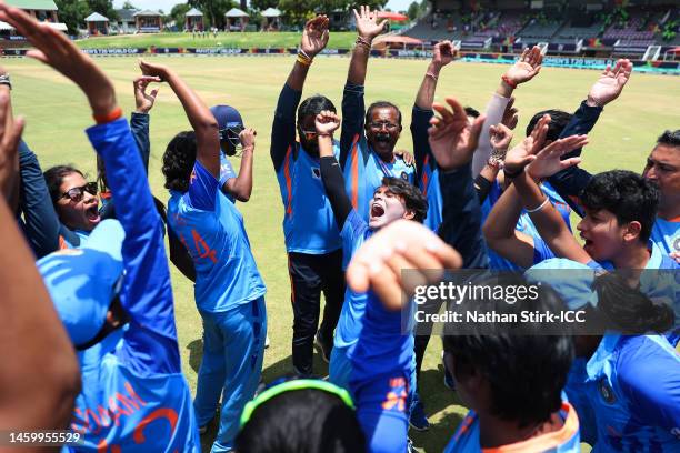 Players of India celebrate as they huddle after defeating New Zealand during the ICC Women's U19 T20 World Cup 2023 Semi Final match between India...