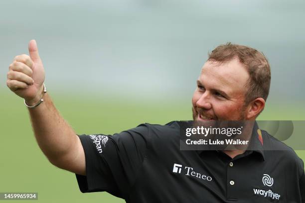 Shane Lowry of Ireland gives a thumbs up upon leaving the 18th green during Day Two of the Hero Dubai Desert Classic at Emirates Golf Club on January...