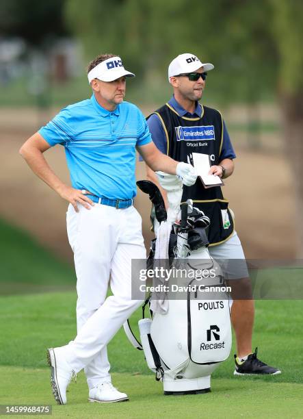 Ian Poulter of England prepares to play his second shot on the first hole during the completion of his first round on Day Two the Hero Dubai Desert...