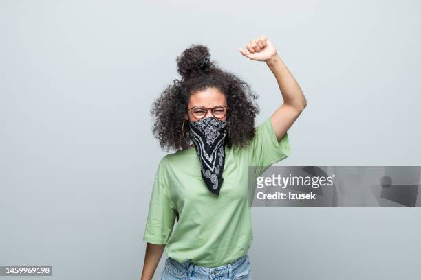 portrait of an angry female activist - loose women stock pictures, royalty-free photos & images