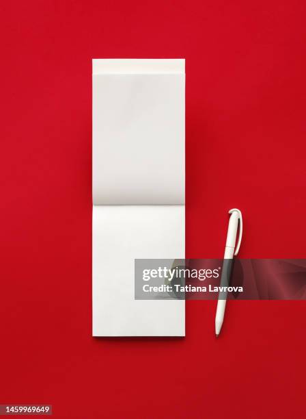 white blank notepad with pen. new chapter of life. minimalistic flat lay with copy space. goals setting, finance and economy, creativity, analysis concept - sketch pad stock pictures, royalty-free photos & images