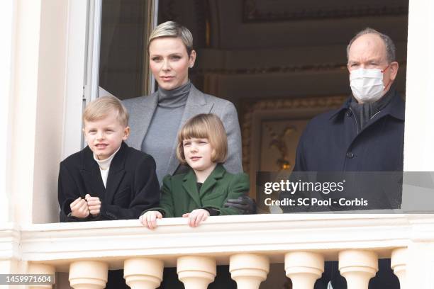 Princess Charlene of Monaco, Prince Jacques of Monaco, Princess Gabriella of Monaco and Prince Albert II of Monaco appear at the Palace balcony...