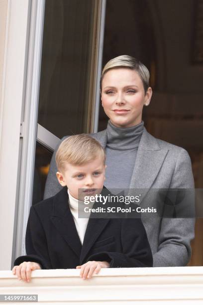 Princess Charlene of Monaco and Prince Jacques of Monaco appear at the Palace balcony during the Sainte Devote Celebration on January 27, 2023 in...