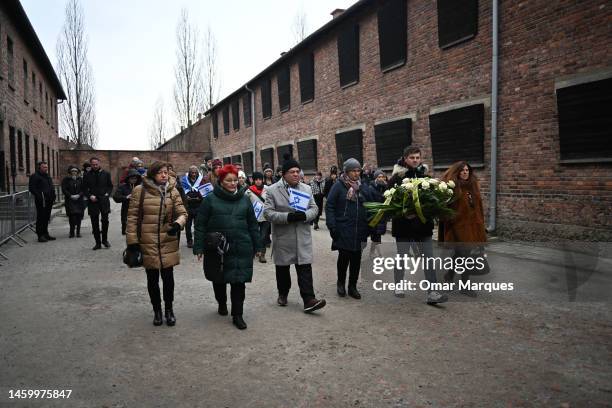Members of the Israel school teachers union arrive to lay wreaths honoring victims of the Nazi regime by the death wall during the Holocaust...