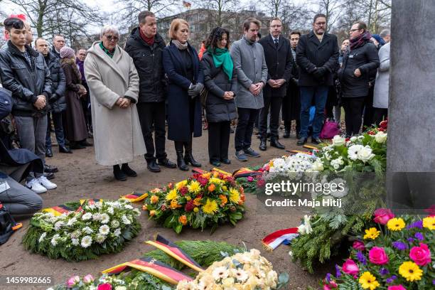 German politicians Claudia Roth and Bettina Jarasch stand among guests during the remembrance ceremony at the main memorial that commemorates...