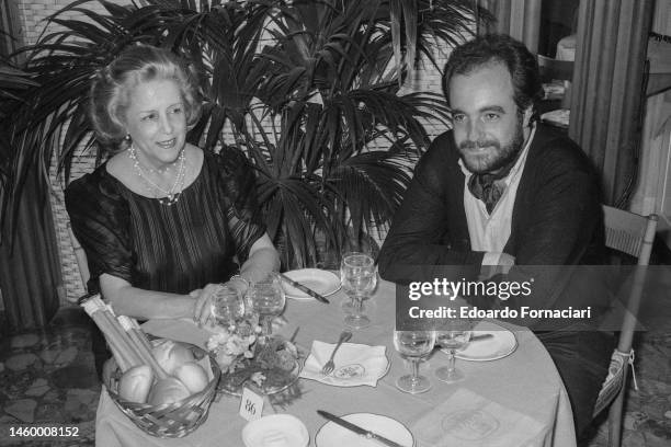 Spanish actress Maria Mercader and her son, composer Manuel De Sica , sit together in a restaurant during the Venice Film Festival, Venice, Italy,...