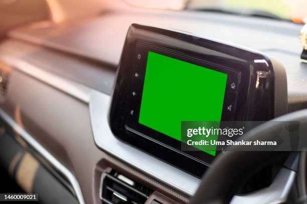 car navigation system (gps) and multimedia infotainment in the car with a green screen. - gps stock-fotos und bilder
