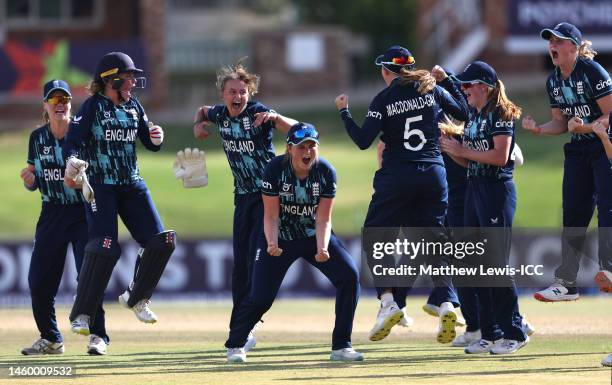 Grace Scrivens of England celebrates with teammates after Milly Illingworth of Australia is run out during the ICC Women's U19 T20 World Cup 2023...
