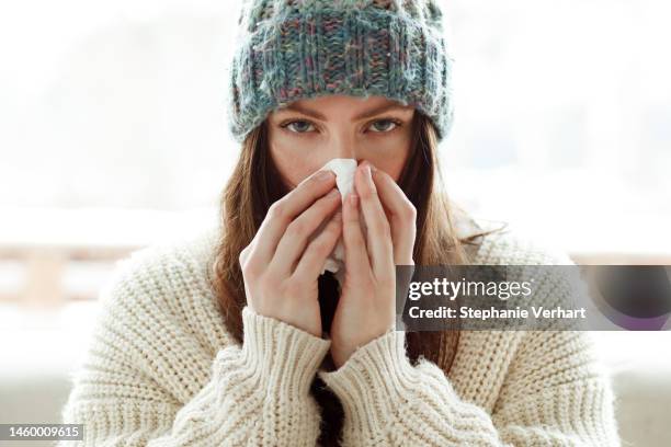 this runny nose is starting to ruin my day - caucasian woman sick in bed coughing stock pictures, royalty-free photos & images