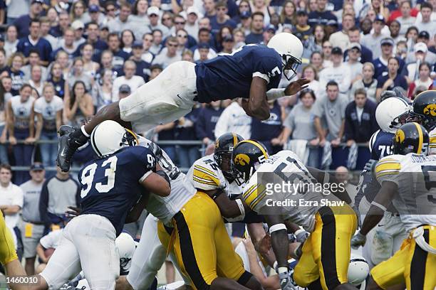 Larry Johnson of the Penn State leaps over the line for a touchdown in the third quarter of the game against Iowa on September 28, 2002 at Beaver...
