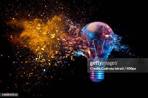 explosion of a traditional electric bulb shot taken in high speed,romania - planet collision stock-fotos und bilder