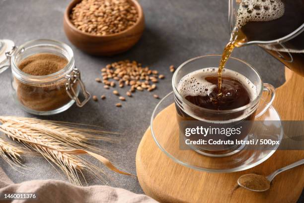 barley coffee in white cup and ears of barley on gray background,romania - cereal bar fotografías e imágenes de stock