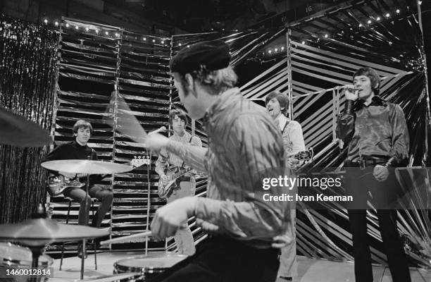 English pop and rock group the Hollies on stage performing the song 'On a Carousel' on the set of a pop music television show in London in February...