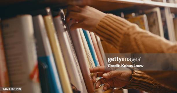 library, knowledge and hands with books on bookshelf for reading, learning and educational research. bookstore, information and girl search, select and choose textbook, academic journal or literature - librarian stock pictures, royalty-free photos & images