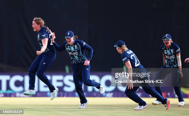 Grace Scrivens of England celebrates with teammates after Maggie Clark of Australia is dismissed by leg-before-wicket during the ICC Women's U19 T20...
