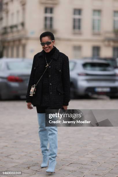 Tamu McPherson seen wearing a black Chanel coat, black turtleneck, black leggings and high babyblue boots and sunglasses, outside the Chanel Show,...