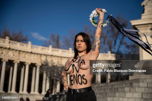 Activist with body paint reading 'Not one less' protest against domestic violence held at El Retiro Park on January 27, 2023 in Madrid, Spain. Since...