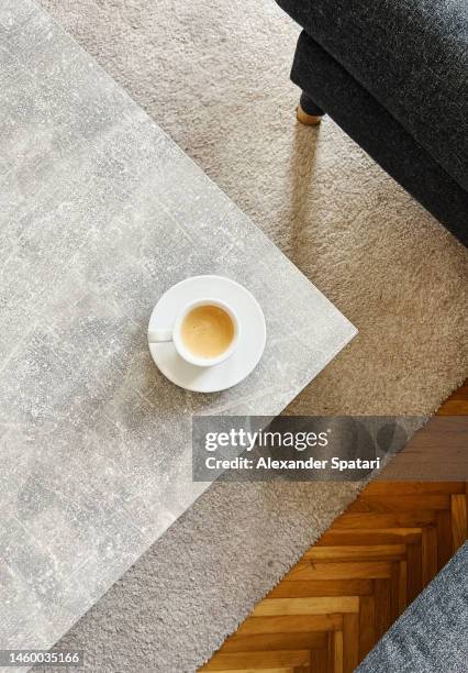 cup of coffee on the coffee table, directly above view - table basse photos et images de collection