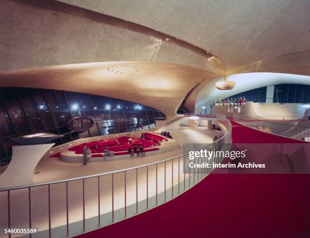 View of an empty lounge or waiting area inside the Trans World Flight Center at John F Kennedy International Airport, New York, 1962. It was designed...