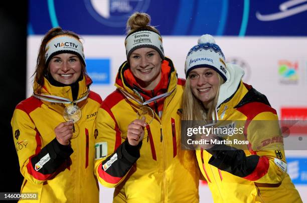 Anna Berreiter , Dajana Eitberger and Julia Taubitz of Germany pose with their medal during the medal ceremony after the Luge Sprint Women's Final...