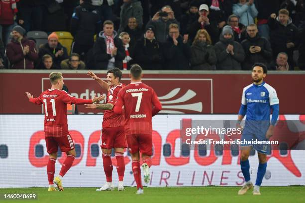 Dawid Kownacki of Fortuna Düsseldorf celebrates with team mates after scoring their team's second goal during the Second Bundesliga match between...