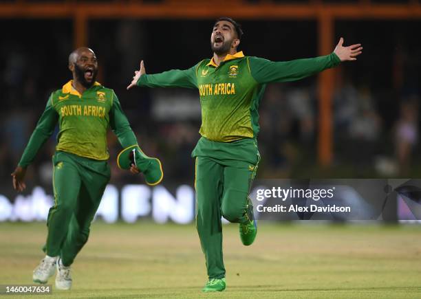 Tabraiz Shamsi of South Africa celebrates with captain Temba Bavuma after taking the wicket of Olly Stone to win the 1st One Day International...