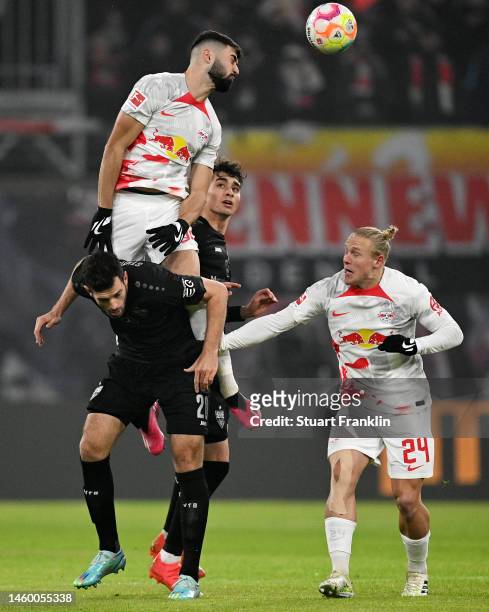 Josko Gvardiol of RB Leipzig contends for the aerial ball with Luca Pfeiffer of VfB Stuttgart during the Bundesliga match between RB Leipzig and VfB...