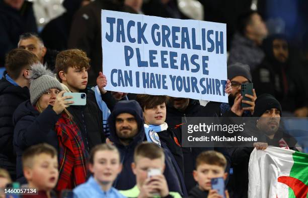 Fan of Manchester City, holds up a sign which reads 'Jack Grealish Pleeease Can I Have Your Shirt', prior to the Emirates FA Cup Fourth Round match...