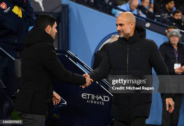 Mikel Arteta, Manager of Arsenal, shakes hands with Pep Guardiola, Manager of Manchester City, prior to the Emirates FA Cup Fourth Round match...
