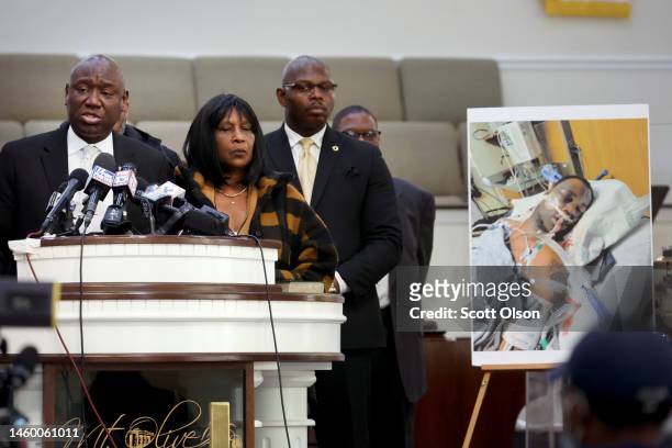 Flanked by Rodney Wells and RowVaughn Wells, the stepfather and mother of Tyre Nichols, civil rights attorney Ben Crump speaks next to a photo of...